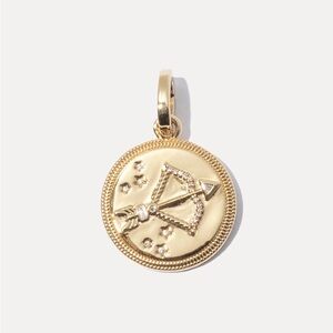 Miranda Frye gold arrow charm